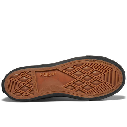 A black shoe's brown rubber outsole set against a plain white background.