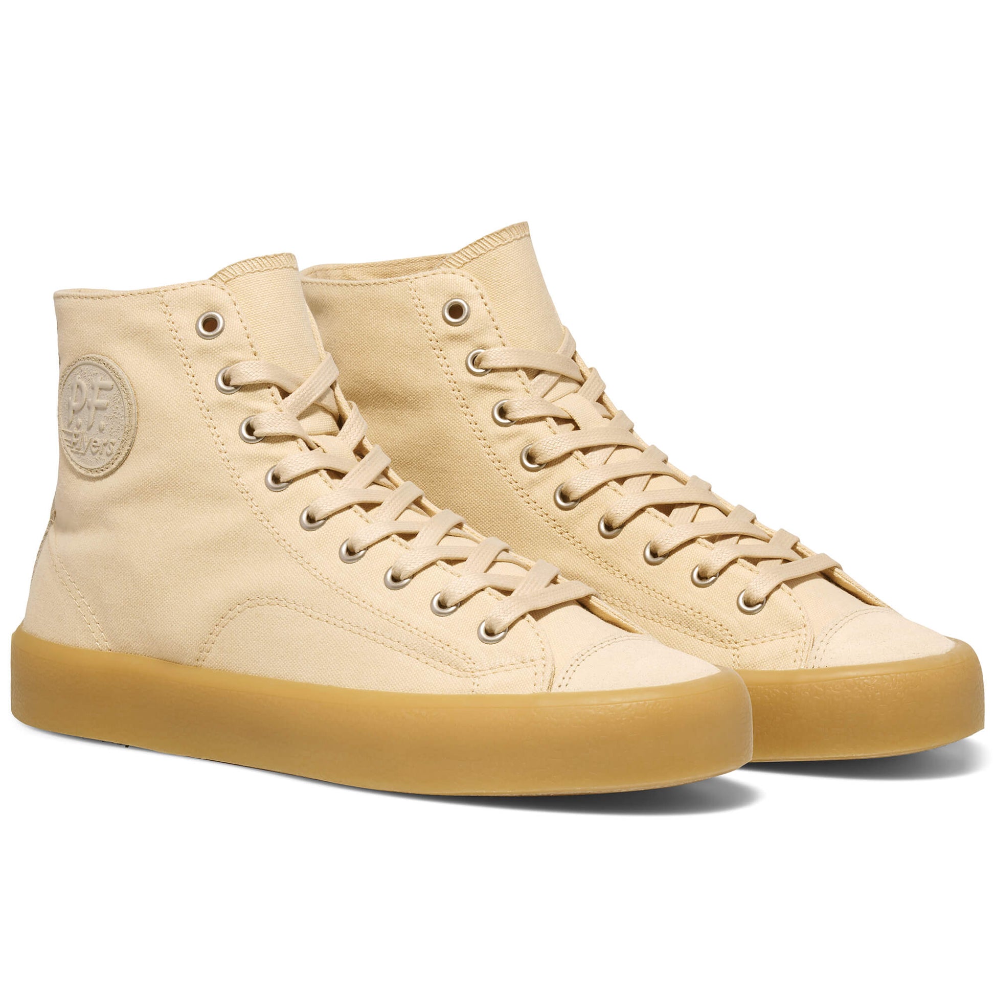 Beige high-top sneakers with 'P.F. Flyers' logo on a white background.