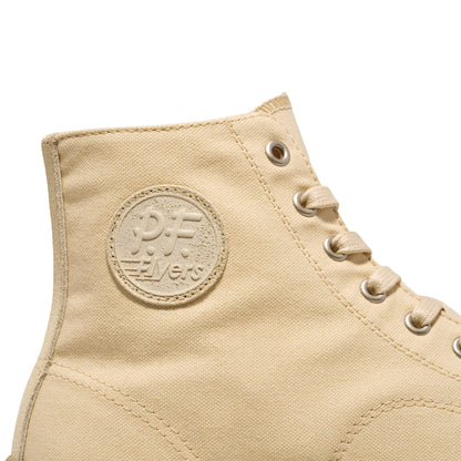 Beige high-top sneaker with a 'P.F. Flyers' logo on a white background.