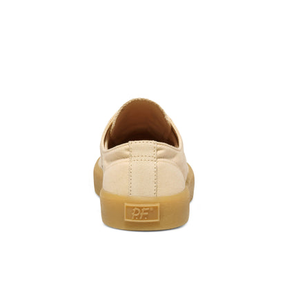 Beige low-top sneaker with a tan sole on a white background.