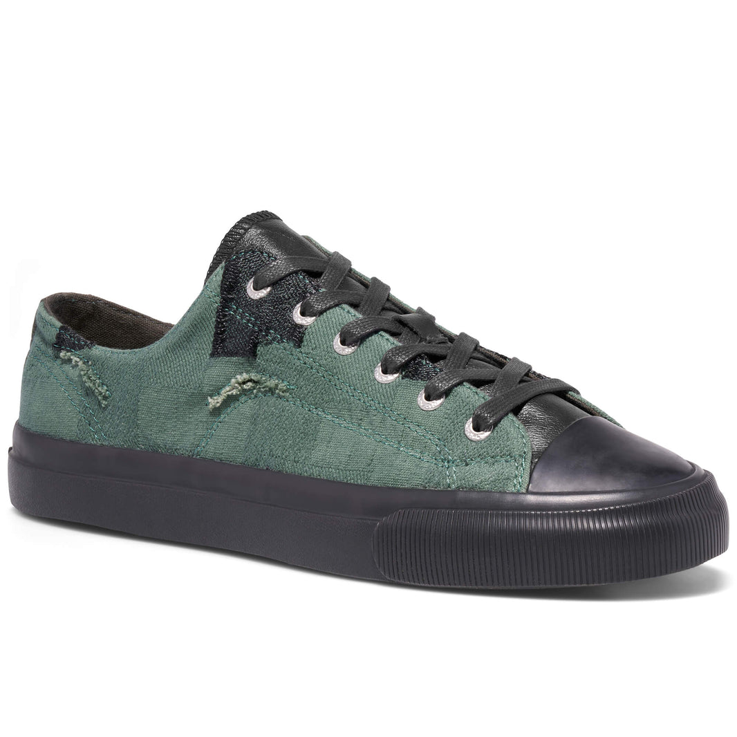 Green and black sneaker on a white background