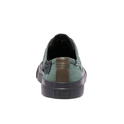 Green slip-on sneaker with brown sole on a white background