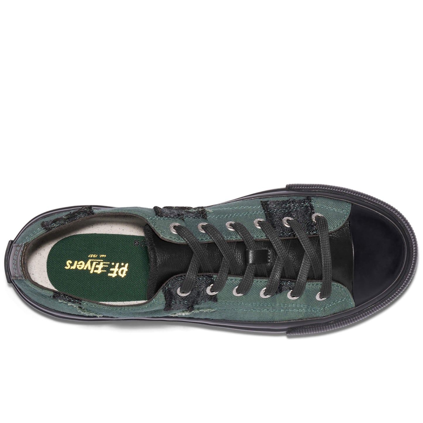 Green sneaker with black laces on a white background