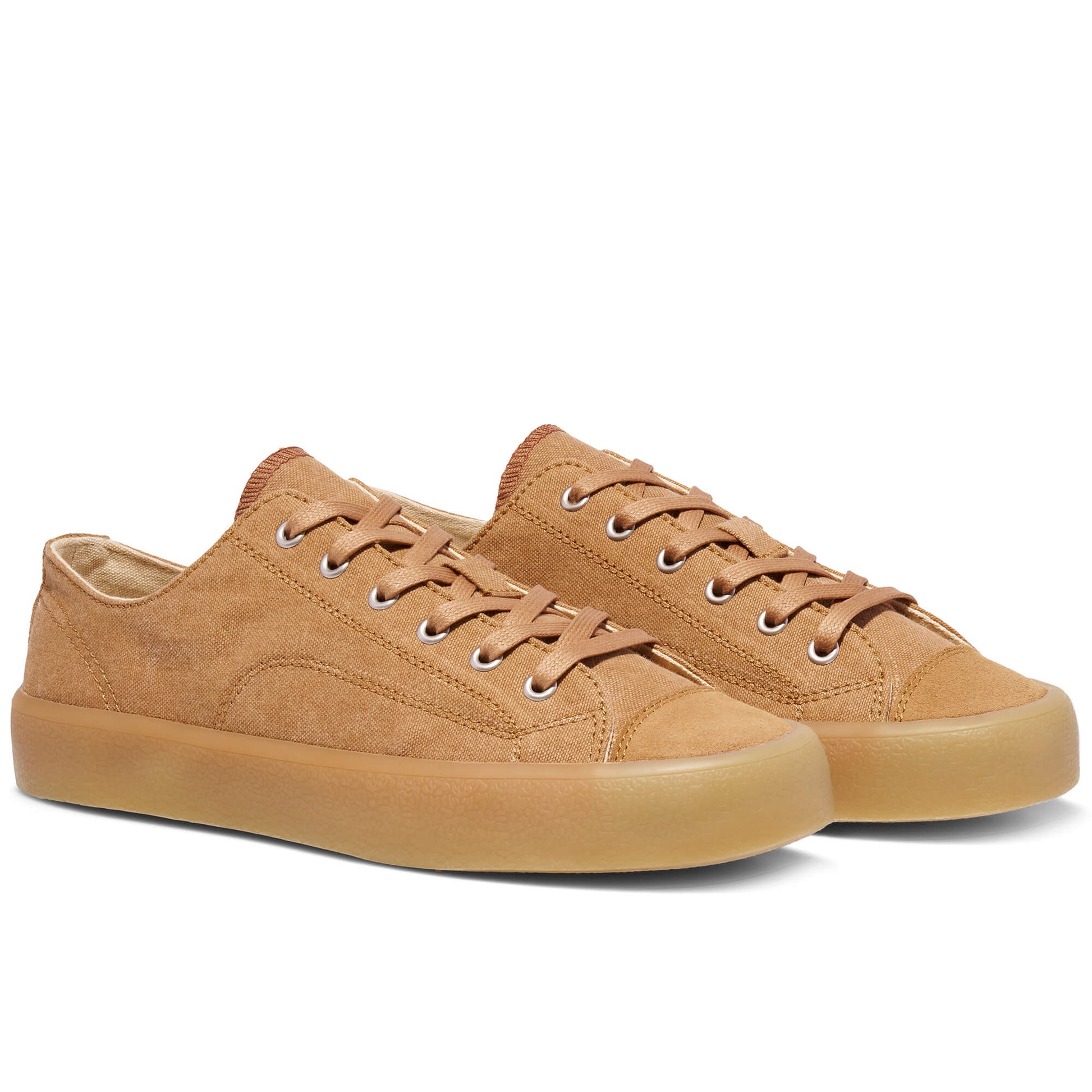Tan low-top sneakers on a white background.