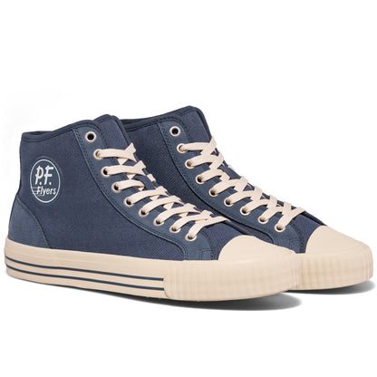 Pair of blue high-top sneakers with white laces on a white background