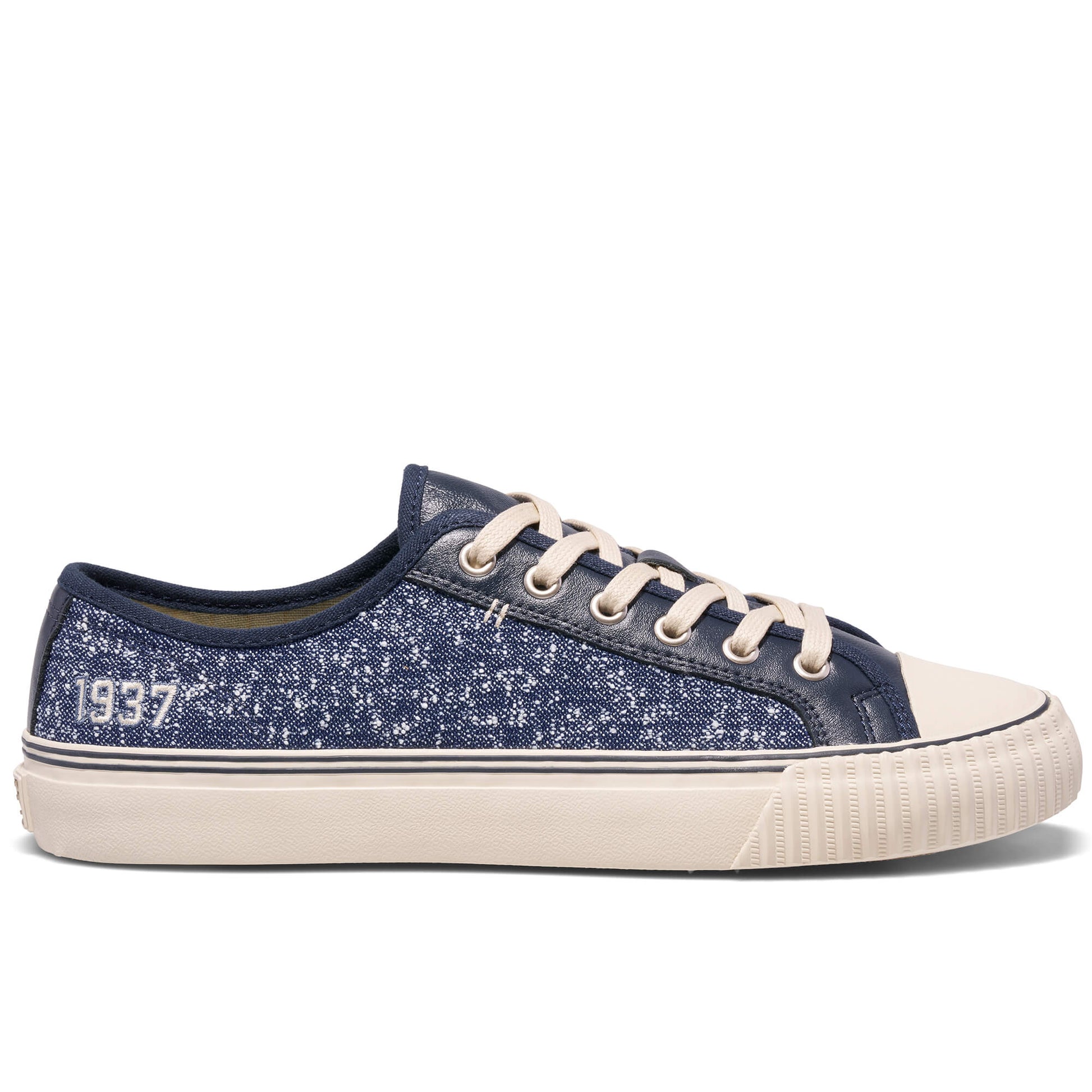 Navy blue sneaker with white laces and sole on a white background