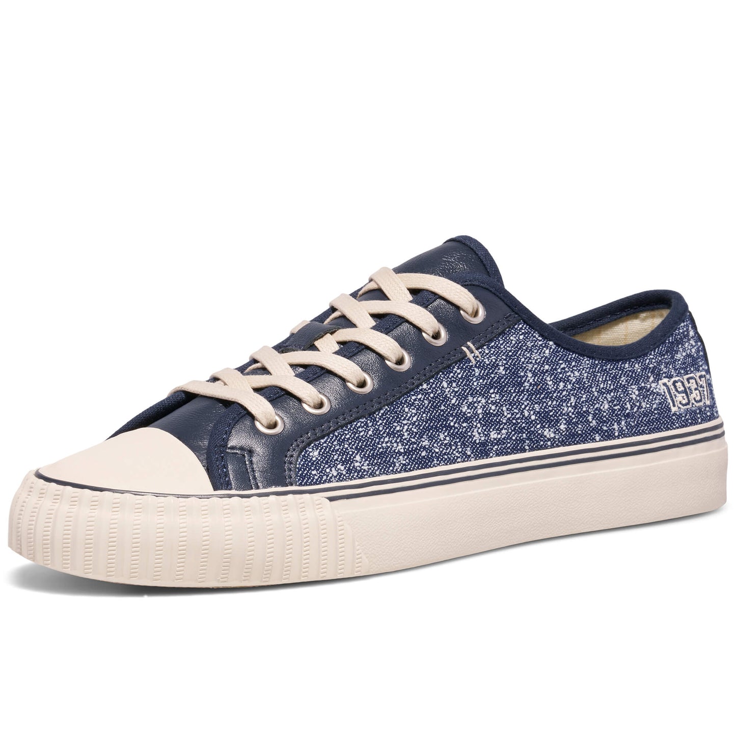 Blue denim sneaker with white laces and sole on a white background