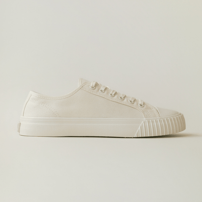 White low-top sneaker on a light background.