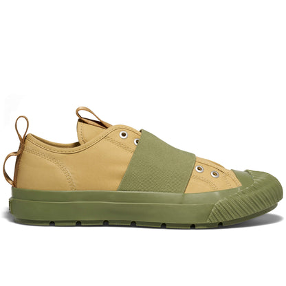 Two-tone sneaker with beige and green color scheme on a white background