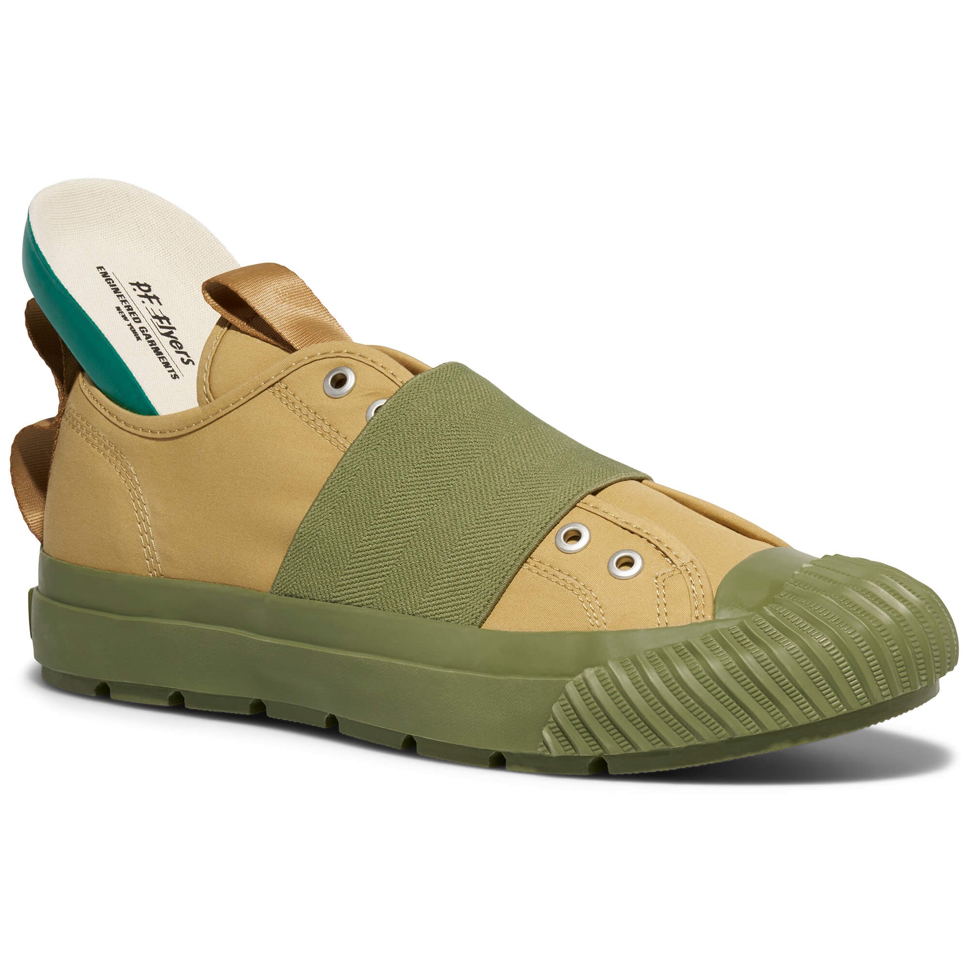 Green and beige shoe with a strap on a white background
