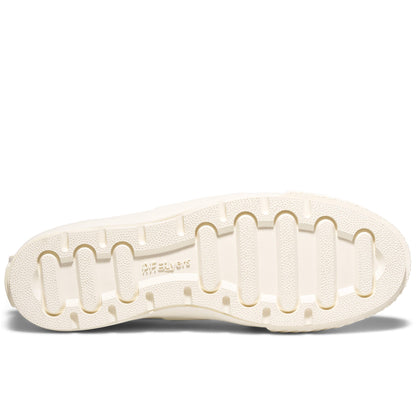 Close-up of a white shoe sole with brand name on a white background