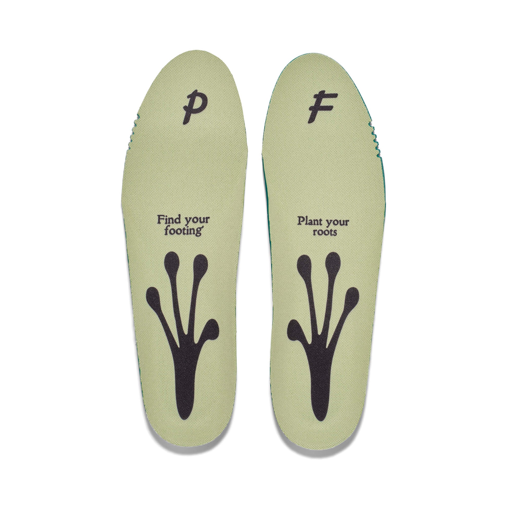 Pair of green shoe insoles on a white background, featuring a frog foot silhouette and the phrases “Find your footing” and “Plant your roots” printed on them.