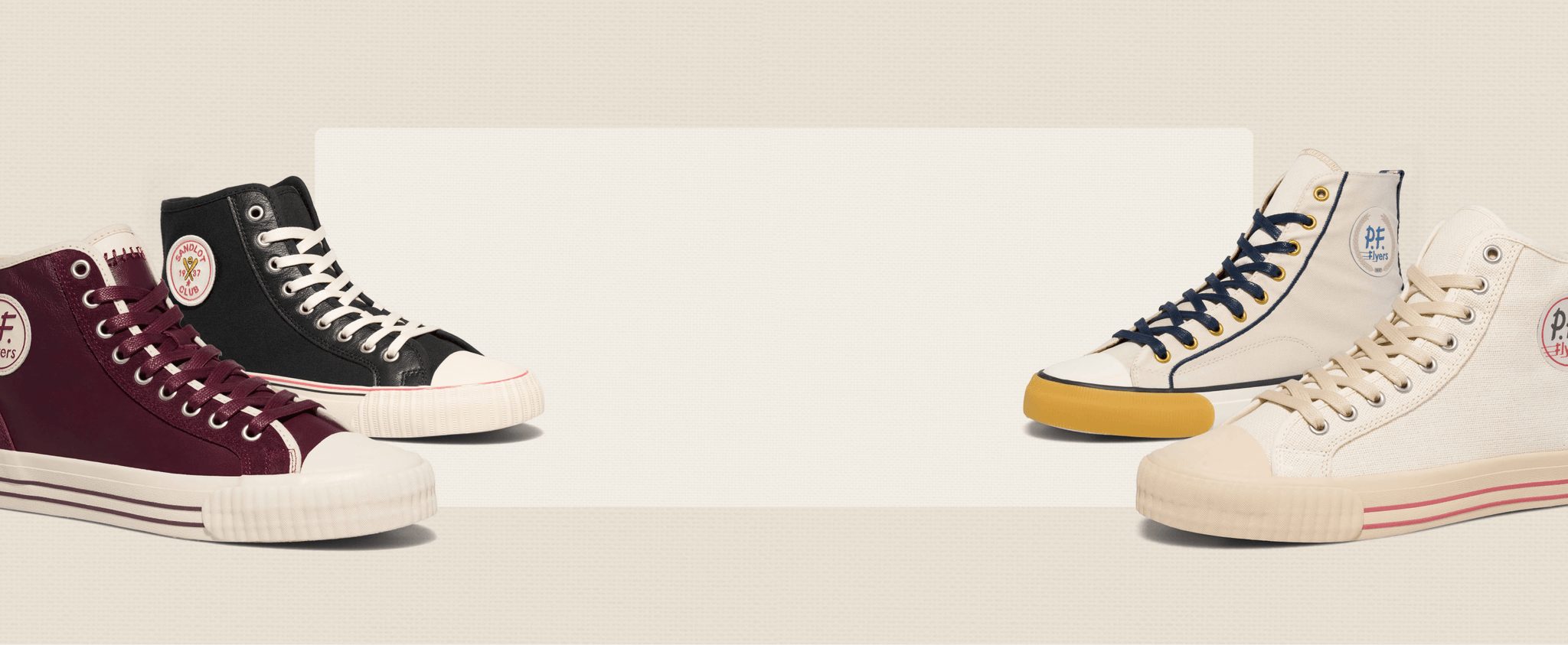 Four pairs of high-top sneakers in different colors on a light background