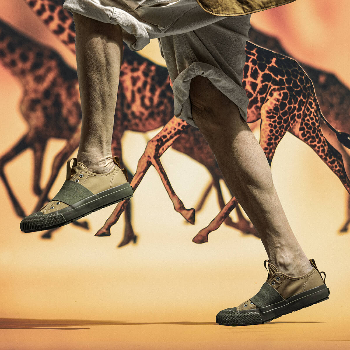 Person wearing green sneakers with a background of giraffes running.